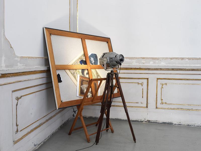 Teogonia, 1982-2024, collage on reversed canvas, drawings holder, reflector, canvas 100 x 125 cm - h 144 x 84 x 125 cm overall dimensions 